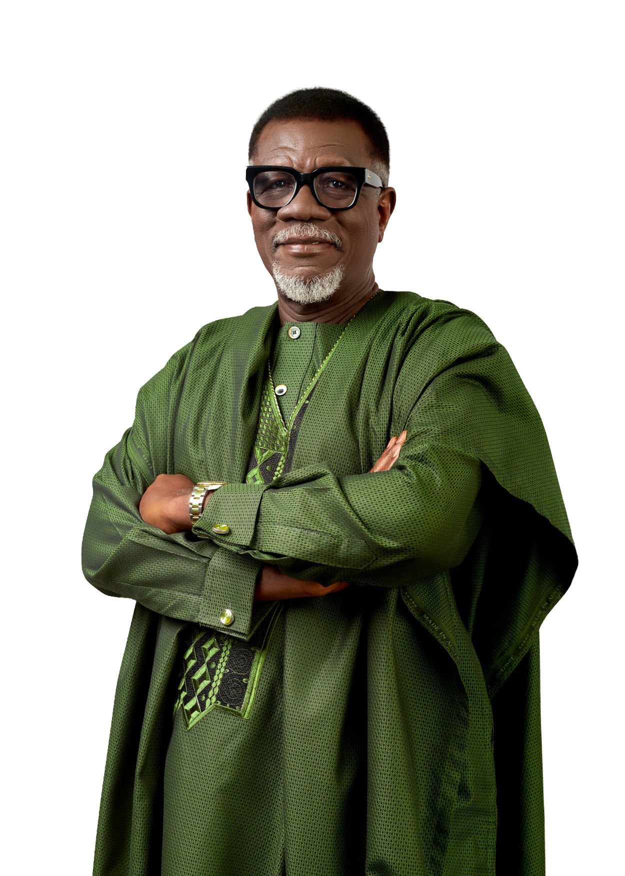 Mensa Otabil in a green agbada, arms folded, full figure